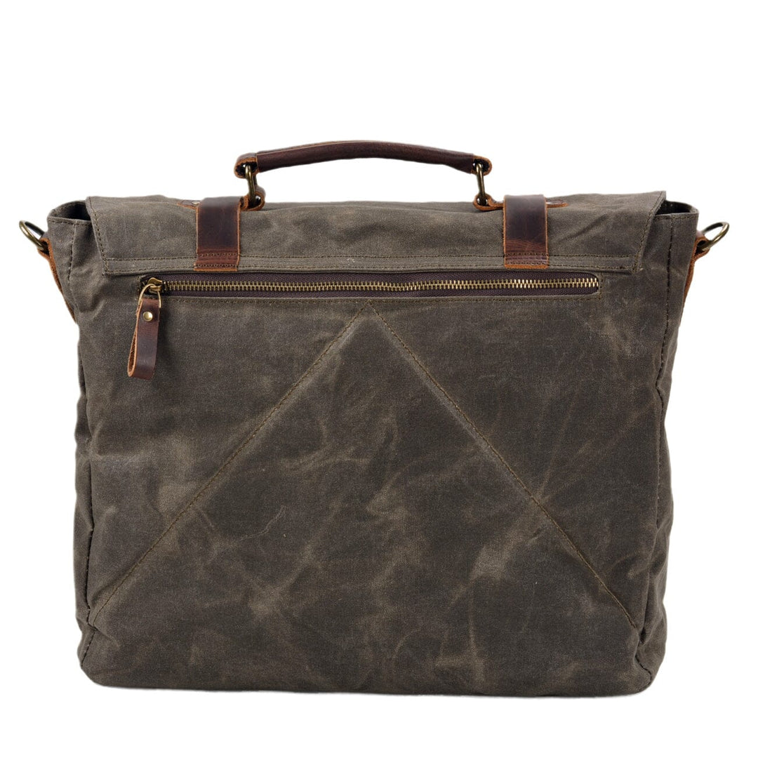 Canvas and leather clutch bag | BRUGES