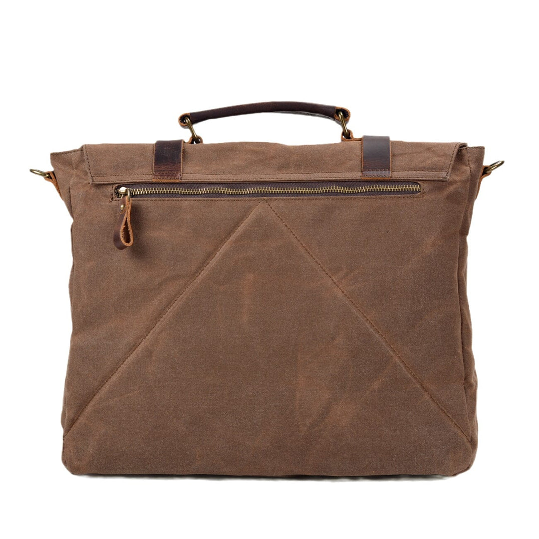 Canvas and leather clutch bag | BRUGES