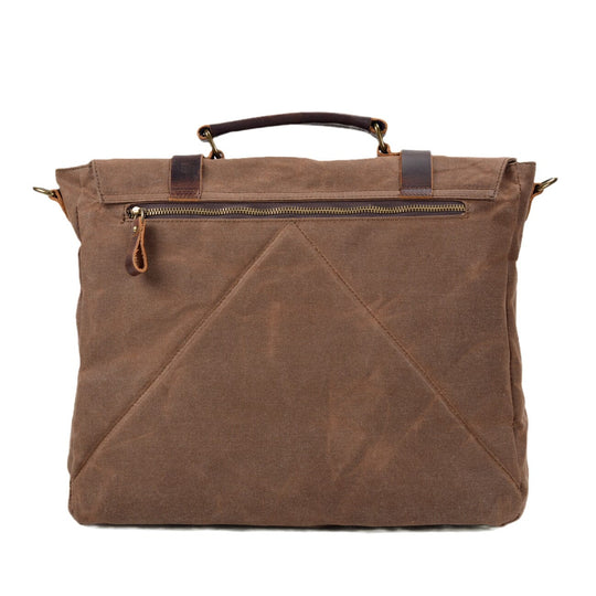 Canvas and leather clutch bag | BRUGES