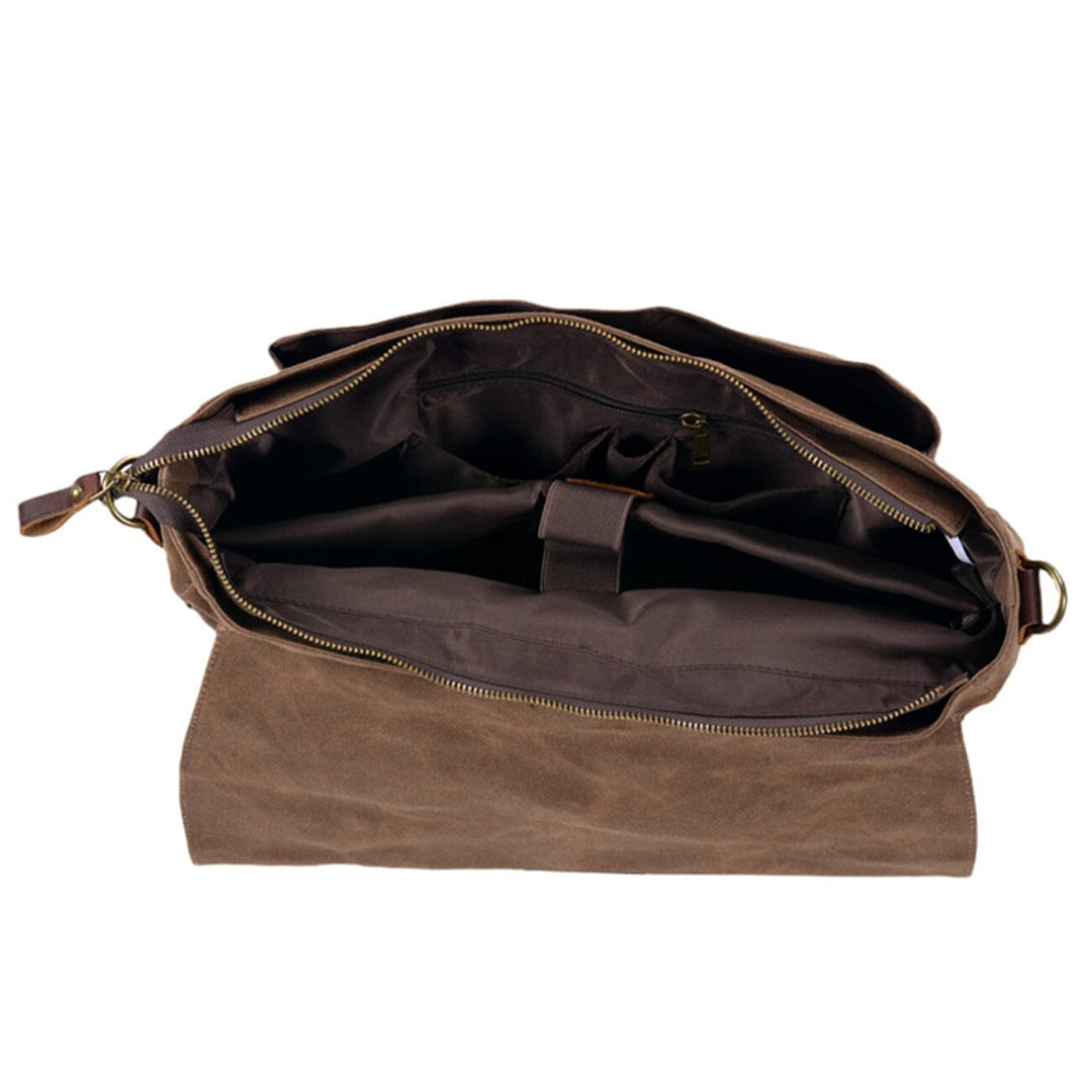 Canvas and leather clutch bag | BRUGES
